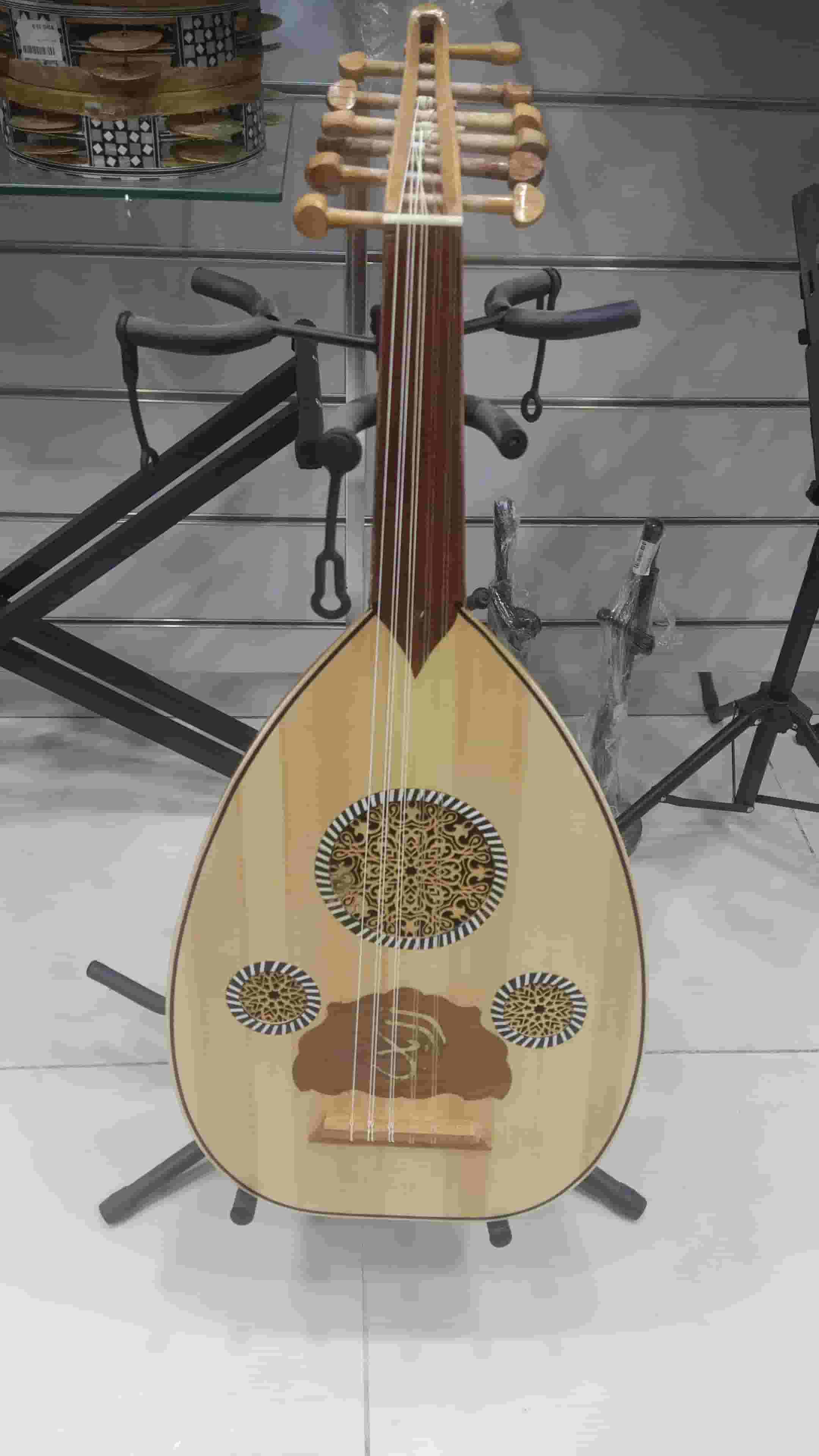 A new Egyptian educational oud with a bag and two feathers