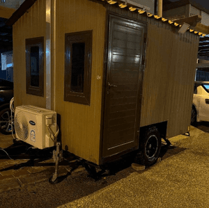 A caravan in the shape of a hut