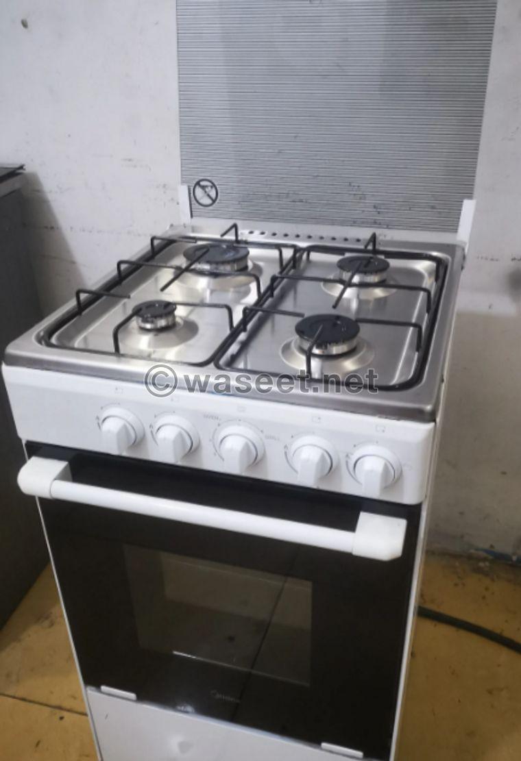 Four-burner stove, oven and grill size 50 1