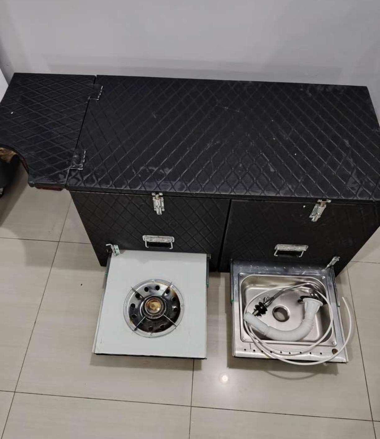 For sale a box equipped for trips with a gas tank and a laundry 0